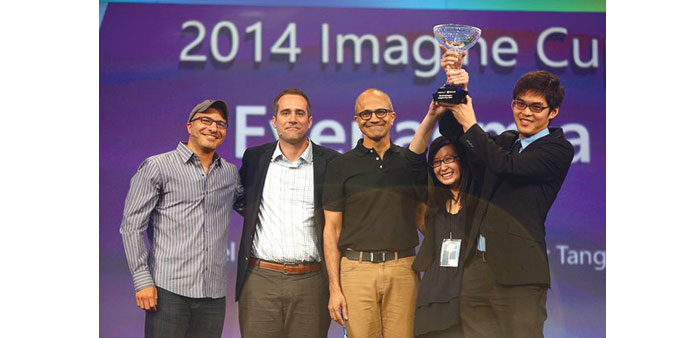 Australian  Jarrel Seah and Jennifer Tang holding the Imagine Cup 2014 in Seattle. Also seen are the finalist