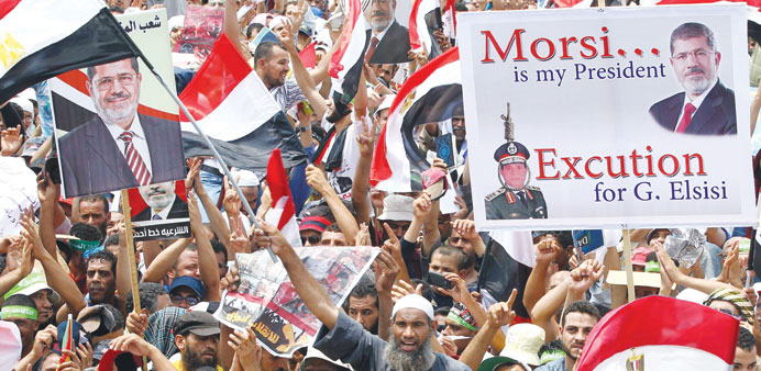 Supporters of Mursi demonstrate near the Rabaah al-Adawiya mosque in Cairo yesterday.