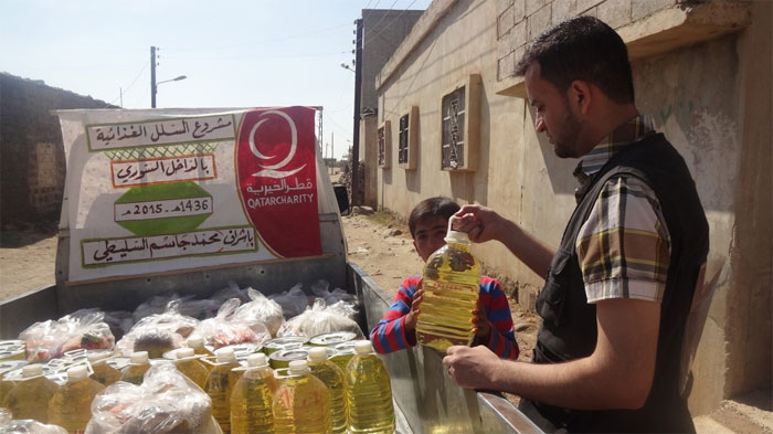 The distribution of food parcels in Rastan, northern Homs.