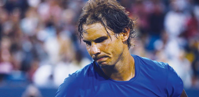 Rafael Nadal reacts after losing his match to Feliciano Lopez in Cincinnati, Ohio, on Thursday. (AFP)