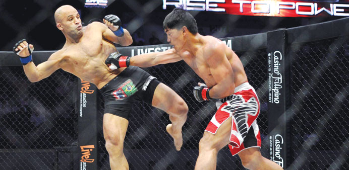 Eduard Foyalang (right) fights with Kamal Shalorus of Iran during their lightweight fight of the One Fighting Championship (One FC) at the Mall of Asi