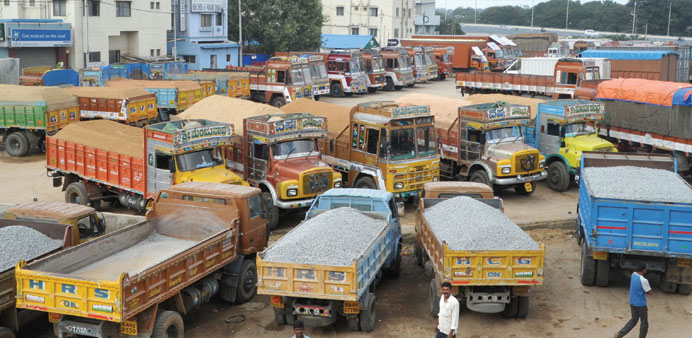 Trucks are parked in a yard in Bengaluru after transporters under the banner of All India Motor Transport Congress (AIMTC) went on a nationwide strike