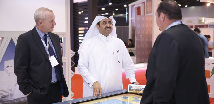 HE the Minister of Energy and Industry Dr Mohamed bin Saleh al-Sada visiting a stand at Cityscape Qatar.