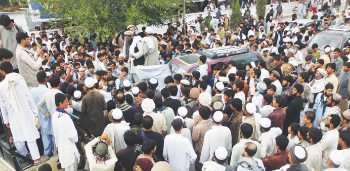 In this photograph taken on September 16, 2012, Afghan residents gather during an anti-Nato protest in Mihtarlam, Laghman Province, after an apparent 