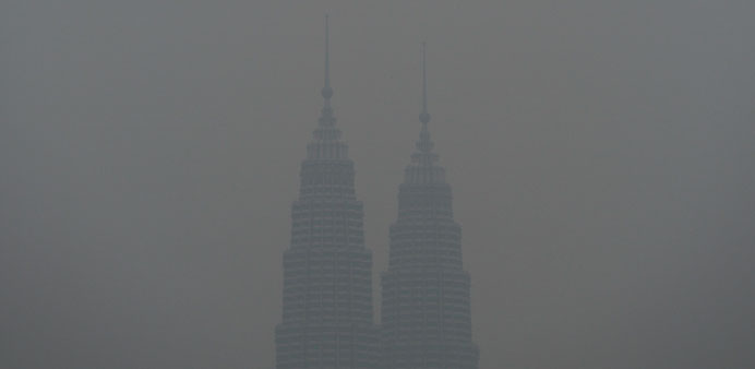Malaysiau2019s landmark Petronas Twin Towers are covered in haze in Kuala Lumpur yesterday. 