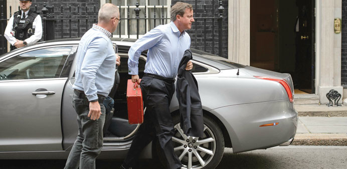   British Prime Minister David Cameron arrives in Downing Street.