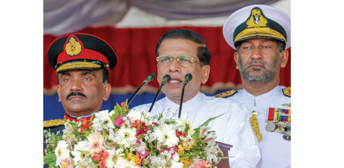  Sri Lankan President Maithripala Sirisena, centre, speaking during an u201cArmed Forces Dayu201d parade in Matara, 160km south of Colombo, yesterday.