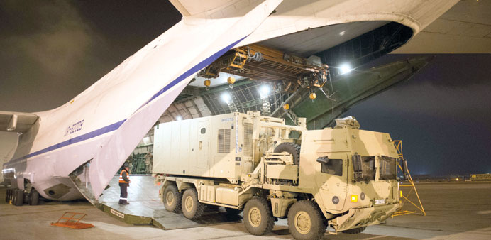 * German Army technical specialists load a heavy transport vehicle aboard a chartered Antononv airfreighter at Camp Marmal in Mazar-e-Sharif, Afghanis
