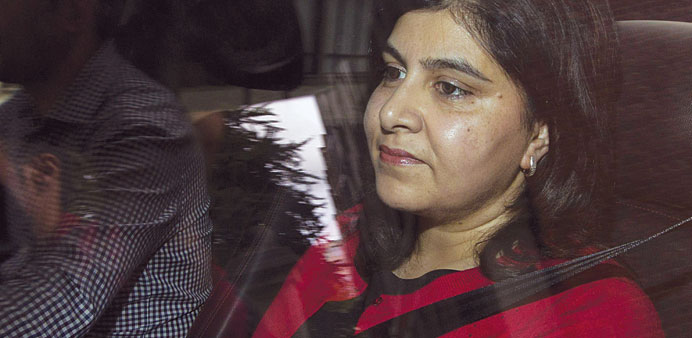 Baroness Warsi is driven away from her home in central London yesterday.