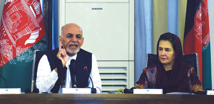 Afghan President Ashraf Ghani speaks as his wife first Lady Rula Ghani listens during a gathering of diplomats and women rights activists at The Minis
