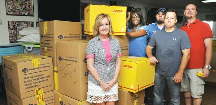 Dunn and McAlpin with other volunteers as they organise boxes of donated items yesterday. PICTURE: Jayan Orma