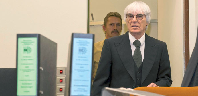 File picture shows F1 supremo Bernie Ecclestone as he arrives to testify in the trial against banker Gerhard Gribkowsky at a district court in Munich 