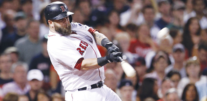 Boston Red Sox Mike Napoli hits a three-run home run against the New York Yankees in the third inning of their MLB American League Baseball game in Bo