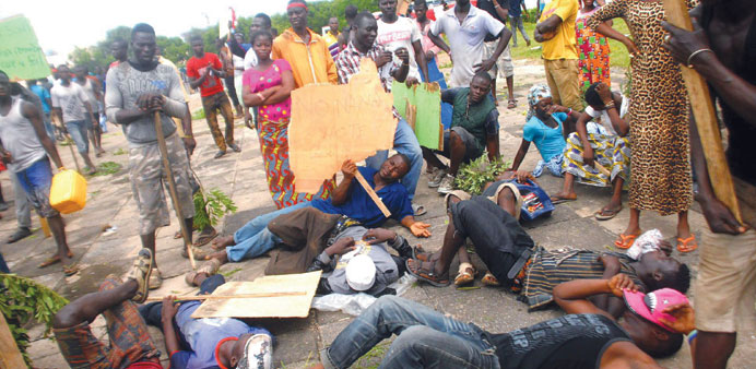 Demonstrators protest outside parliament in Accra after city authorities demolished shanties as part of measures to combat heavy flooding.