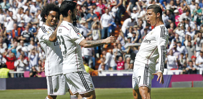 Real Madrid's Cristiano Ronaldo (right) celebrates with teammates after scoring against Eibar. (Reuters)