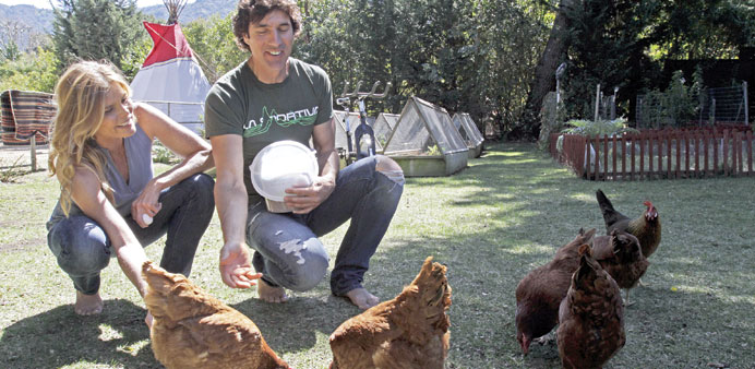  Mariel and Williams feed their chickens at their home in Calabasas, California.