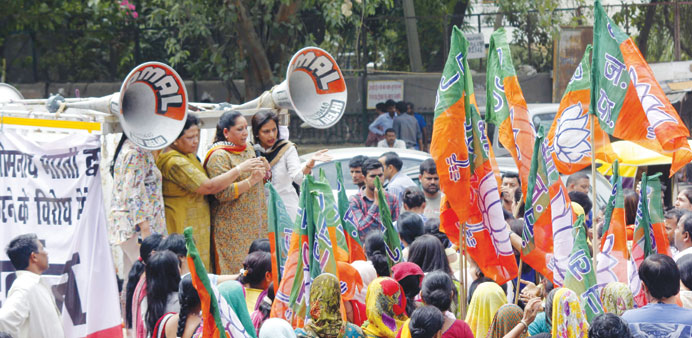 BJP women activists stage a demonstration against AAP legislator Somnath Bharti in Malviya Nagar of New Delhi yesterday.