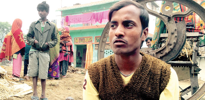 REFLECTION: Mathura Dhobi, who was married at age 12, outside his family home in Shihokhor, Nepal. 
