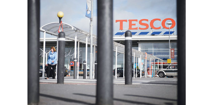 A Tesco supermarket is seen in north London. Tesco yesterday issued another profits warning and slashed its shareholder dividend by 75%, blaming chall
