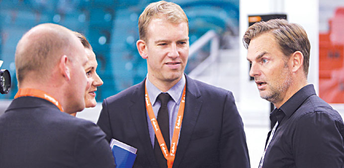 Ronald de Boer (R) interacts with guests at the Aspire4Sport Conference yesterday