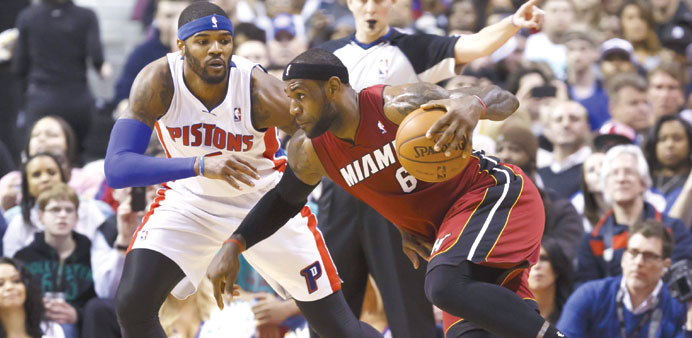 Miami Heat forward LeBron James (right) dribbles past Josh Smith of Detroit Pistons during their NBA match at the Auburn Hills. Picture: USA TODAY Spo