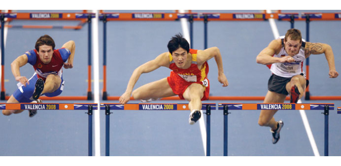 Liu Xiang (C)  will be honoured by China today.