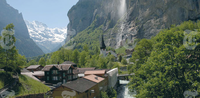 Waterfalls, snow-capped mountains and steep valley walls surround the Alpine town of Lauterbrunnen, deep in Switzerland. PICTURE: Damon Winter/The New