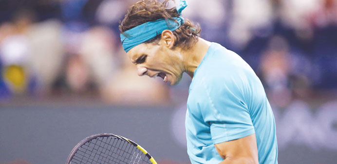 Rafael Nadal celebrates winning a point against Ryan Harrison of the United States during their match in Indian Wells on Saturday. (Reuters)