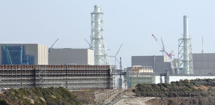    A tsunami barrier stands under construction in Japan. Many firms are choosing to walk away from government projects rather than invest more in equi