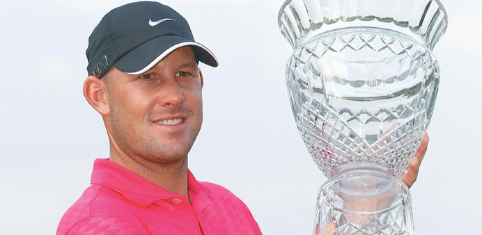 Scott Brown holds the trophy after winning the Puerto Rico Open at the Trump International Golf Club on Sunday in Rio Grande, Puerto Rico. (AFP)