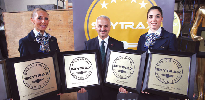 Turkish Airlines officials show off the awards.