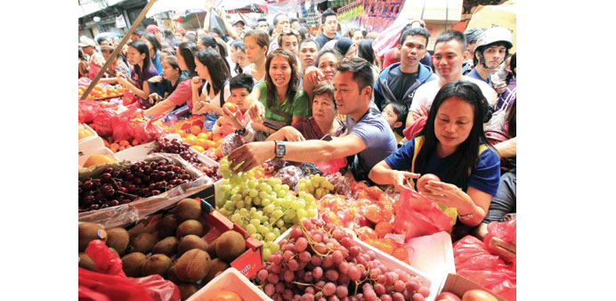 Shoppers at a market in Manila. The Philippine government has set a target of between 2% and 4% average inflation for 2015 and 2016.