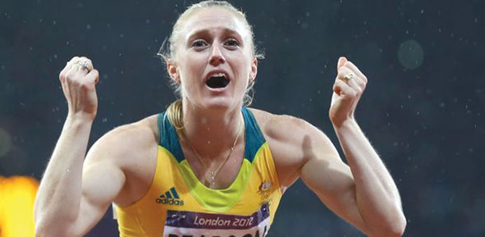 Sally Pearson celebrates winning her 12th Australian athletics title at the national Commonwealth Games trials in Melbourne yesterday.
