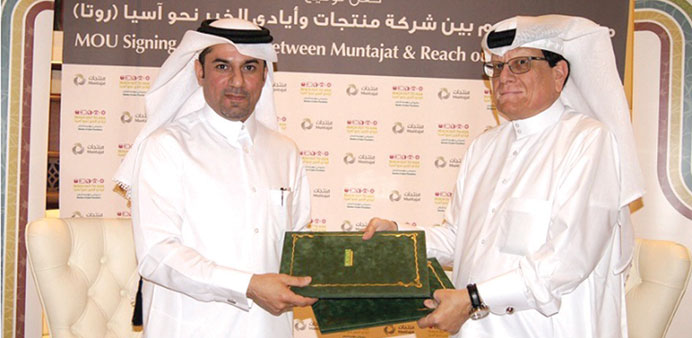 Al-Naama and al-Abdulla at the signing ceremony yesterday.