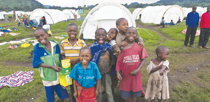 Young refugee children from the Democratic Republic of Congo pose for a picture at the Nyakabande Transit Centre in Kisoro District, in Uganda.
