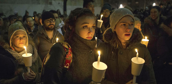 Mourners participate in a candle light vigil for Phillip Seymour Hoffman in Manhattan on Wednesday night.
