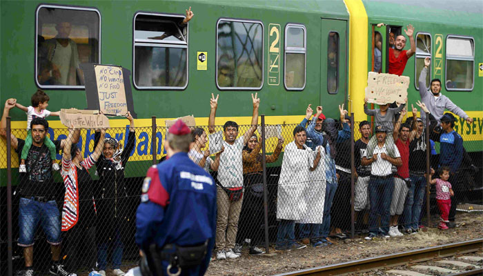 Migrants stage a protest in front of a train at Bicske railway station, Hungary.  REUTERS