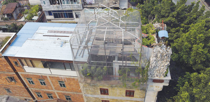 A general view of a giant steel and mesh u201cbirdcageu201d that caps the uppermost level of a building in Guangzhou, southern Chinau2019s Guangdong province yest