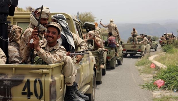 Yemeni fighters loyal to President Abedrabbo Mansour Hadi drive in convoy in the Yafa area some 180 kilometres north of Aden.