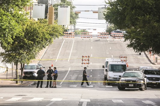 Police block off an area of 6th Street after two shootings yesterday in downtown Austin, Texas.