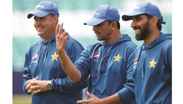 Pakistanu2019s head coach Mickey Arthur (left), bowling coach Azhar Mahmood (centre) and captain Misbah-ul-Haq (right) share a joke during the net session in London yesterday. (Reuters)