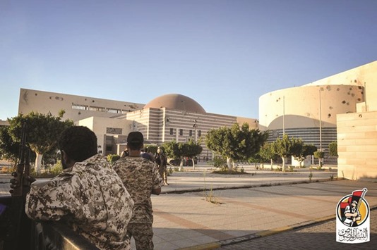 Forces loyal to Libyau2019s unity government in front of the Ouagadougou conference centre in Sirte yesterday.