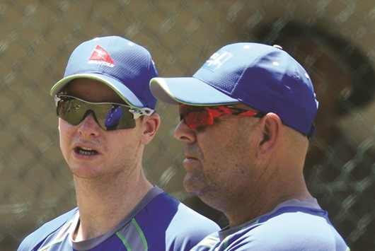 Australia captain Steven Smith (L) talks with coach Darren Lehmann (R) during a training session at The Sinhalese Sports Club (SSC) Ground in Colombo yesterday.