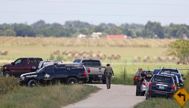 Authorities investigate the site of a hot air balloon accident in Maxwell, Texas.