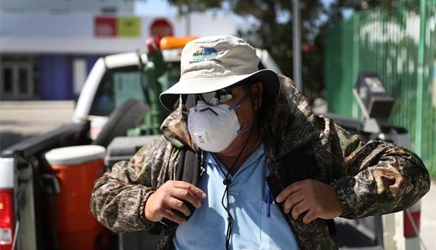 A Miami-Dade County mosquito control inspector prepares to use a fogger to spray pesticide to kill mosquitos in the Wynwood neighbourhood as the county fights to control the Zika virus outbreak in Miami, Florida.