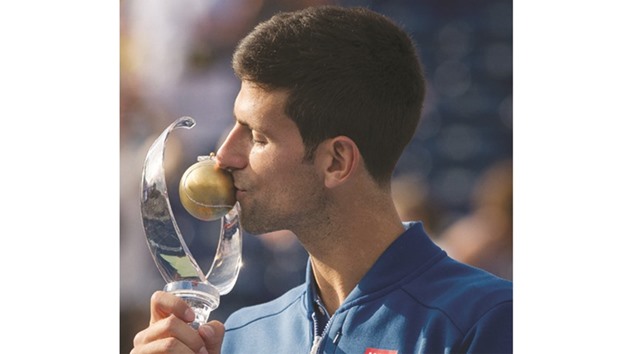 Novak Djokovic of Serbia with his trophy after beating Kei Nishikori of Japan to win the Rogers Cup on Sunday. (AFP)