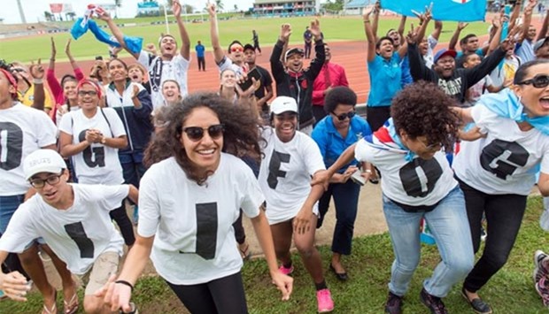 Fijians celebrate the victory of their rugby sevens team against Britain in the final at the Rio Olympics, inside ANZ Stadium in Suva on Friday.