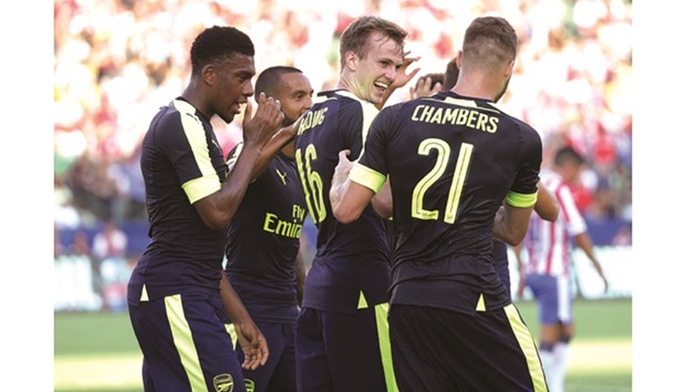 Arsenal's (from left) Alex Iwobi, Theo Walcott, Rob Holding and Calum Chambers celebrate a goal against Chivas de Guadalajara in their pre-season clash in Carson, California. Arsenal won 3-1. (AFP)