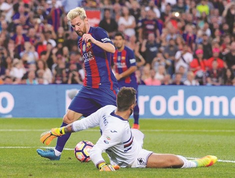 Sampdoriau2019s goalkeeper Emiliano Viviano (L) tries to stop Barcelonau2019s Argentinian forward Lionel Messi during the annual 51st Joan Gamper Trophy friendly football match beteen Barcelona FC and UC Sampdoria at the Camp Nou stadium in Barcelona on August 10.