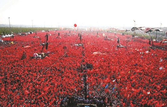 People waving Turkish national flags as they gather on at Yenikapi in Istanbul during the August 7 rally.